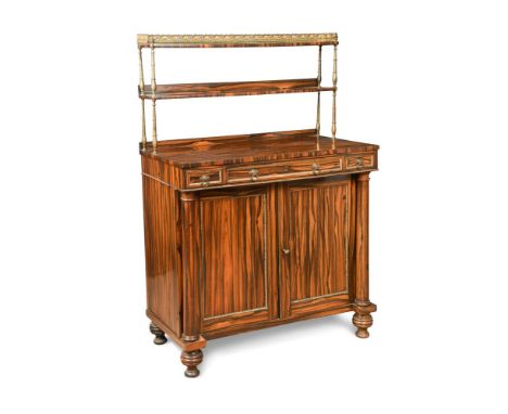A Regency calamander chiffonier, with a raised shelf back on brass columns with a gilt brass gallery, above a base with three