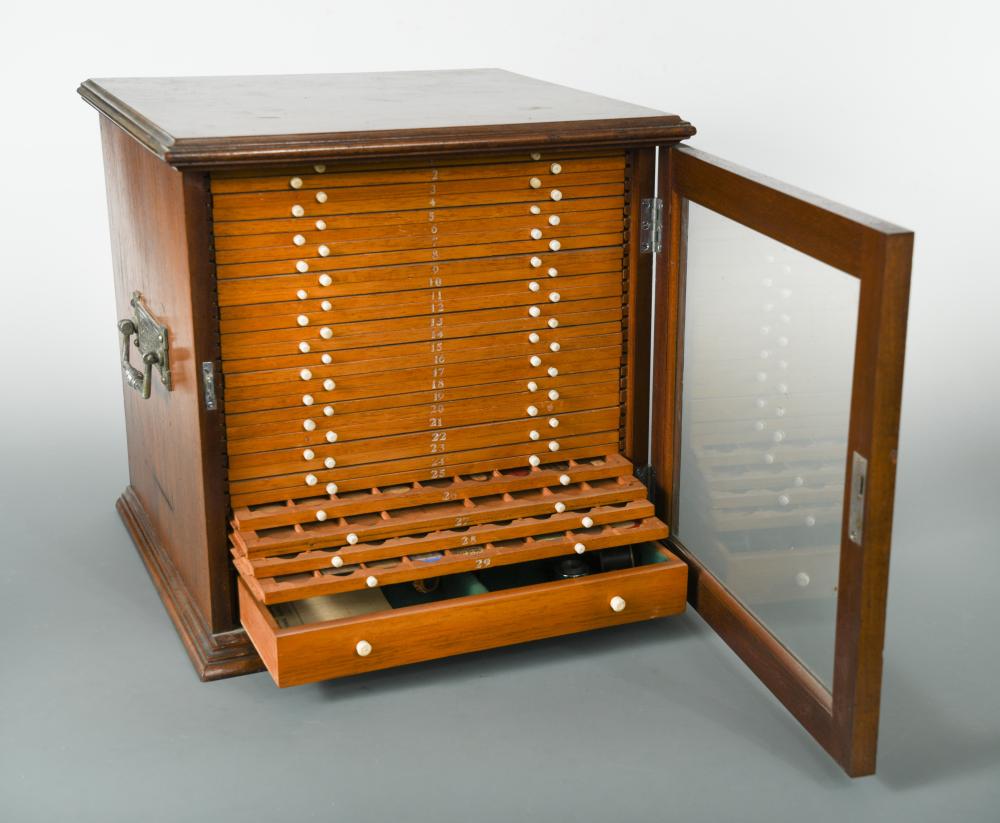 A 19th century mahogany microscopeslide with 29 slide drawers