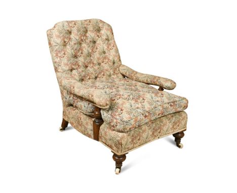 A Victorian 'Howard' style walnut framed lounging chair, circa 1870, with buttoned back, padded arms, raised on walnut suppor