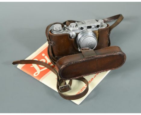 A 1936-7 Leica Model IIIa, no. 227465, with leather case and instruction manual  