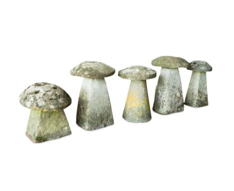 A collection of five weathered staddle stones, of varying sizes together with a pair of pyramidal square stone gate pillar ca