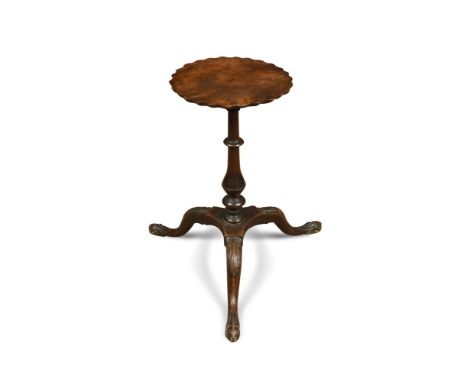 An 18th century mahogany urn stand, the circular top with a crenellated border, on a turned column and tripod base 52 x 27cm 