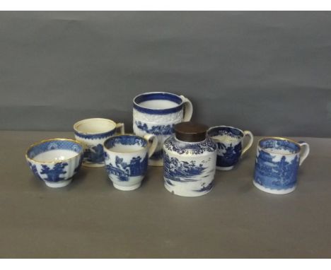 A quantity of blue and white pearlware to include tea caddy, mugs, and teacups, 4'' high (AF)