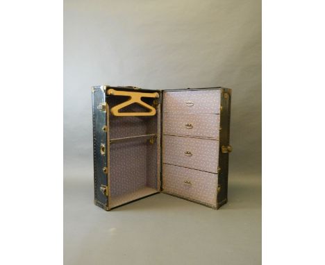 An early C20th 'Watajoy' steamer trunk fitted with four drawers and original coat hangers, with original key, 14'' x 23'' x 3