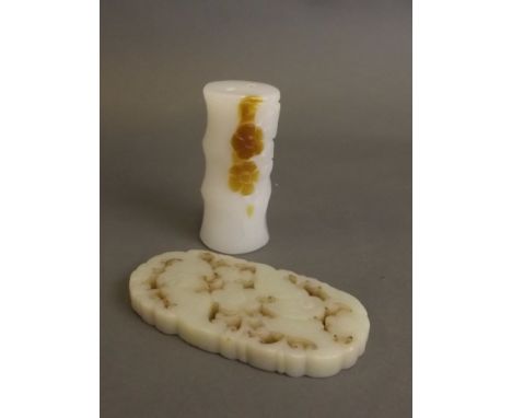 A white jade toggle carved in the form of bamboo, and a celadon jade pierced pendant with carved bat decoration, pendant 3¾''