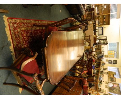A mahogany dining room suite comprising of eight (2 and 6) Chippendale style chairs with carved decoration and pierced splats