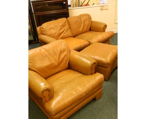 A Tetrad two seater sofa, with matching armchair and footstool in tan leather