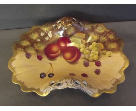 A Worcester style shaped ceramic dish painted with fruit, signed S. Rowan, 12'' diameter