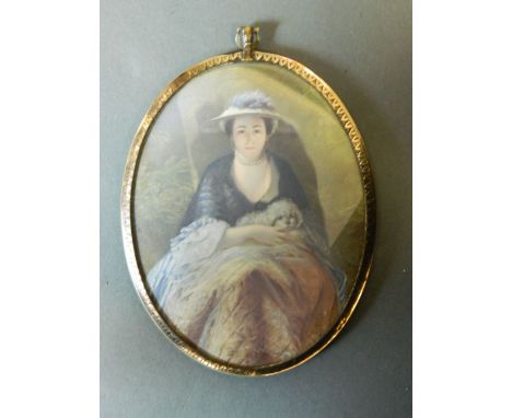 A C19th miniature on ivory, portrait of a young woman in a hat holding her dog in her lap, the reverse with a painting of a c