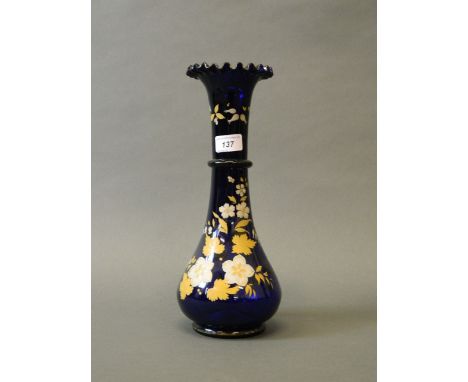 A C19th blue glass vase with frilled rim and enamel decoration with gilt highlights, 13½'' high