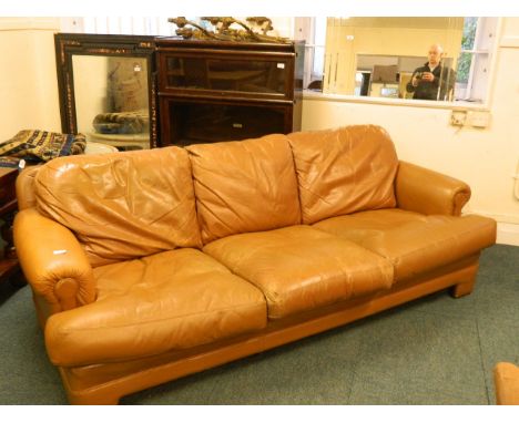 A Tetrad three seater sofa in tan leather
