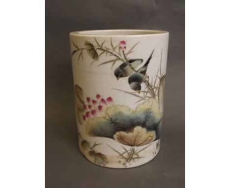 A Chinese cylindrical porcelain brushpot with painted enamel decoration of lovebirds perched on a branch, 6¼'' high, 4¾'' dia