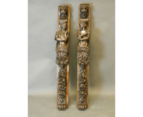 A pair of C19th oak architectural carvings decoration with caryatid and garlands of flowers, 44'' x 5''