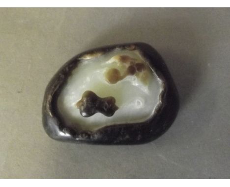 A Chinese two colour jade ornament with bat and gourd decoration, 2¼'' x 1¾''