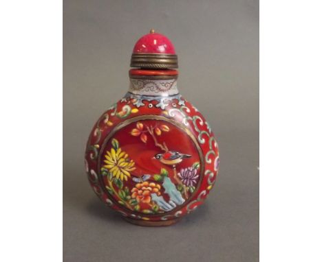 A Peking glass snuff bottle with painted enamel decoration of love birds nestled amongst flowers, 4 character mark, 3'' high