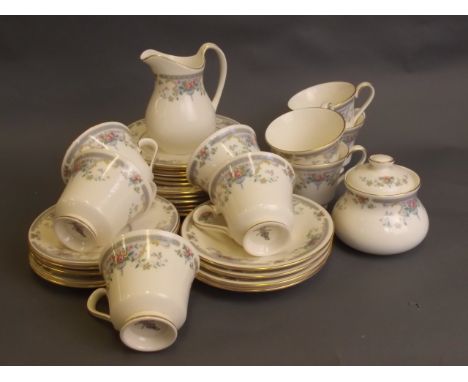 A Royal Doulton part tea set 'Romance' pattern comprising six dessert plates, six tea plates, nine saucers, nine cups, a jug,