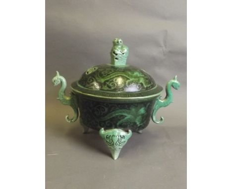 A Chinese green ground porcelain jar and cover with painted black enamel dragon decoration, with twin dragon handles and Fo d