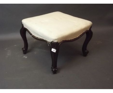 A C19th walnut stool with remains of rosewood graining, on carved cabriole supports, 19'' x 15'' x 19''