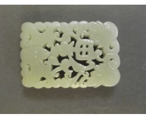 A Chinese pierced and carved celadon jade pendant with bat, dragon and character decoration, 2¼'' x 1½''
