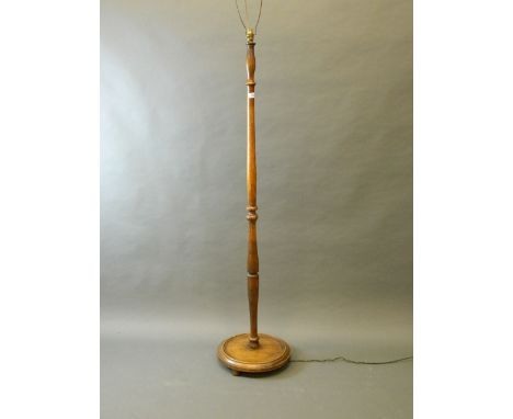 A 1930s oak standard lamp, 61'' high