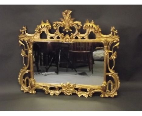 A good carved giltwood overmantle mirror in the Chinese Chippendale style, 44'' x 37½''