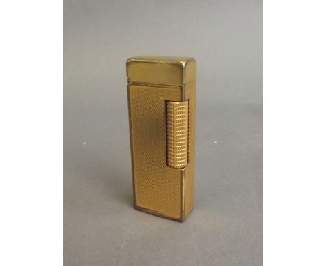 A Dunhill Rollagas gold plated lighter, 2½'' x 1'' (AF), Best Bid