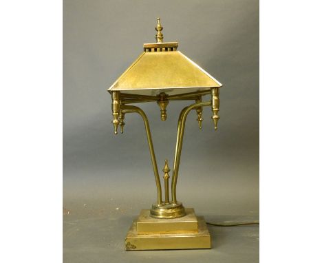 A brass table lamp and shade, 21'' high