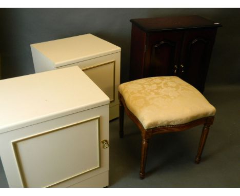 A contemporary mahogany cupboard with moulded fielded panel doors, a pair of bedside cupboards, and a serpentine shaped foots