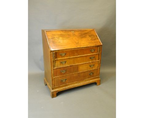 A late C19th walnut fall front bureau with fitted interior and four long drawers, on bracket feet, 36'' x 18½'', 40'' high
