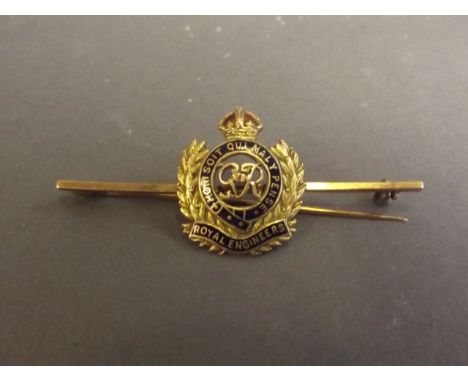 A 9ct gold and enamel tie pin with a badge for the Royal Engineers