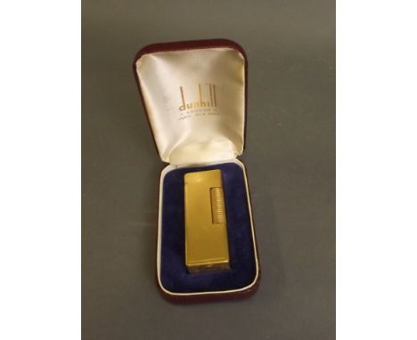 A boxed engine turned Dunhill lighter, 2½'' long