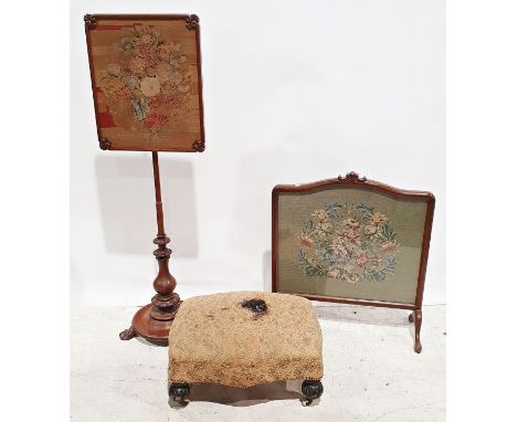 Early Victorian footstool, the lozenge-shaped upholstered top on turned supports to white china castors and a needlework fire