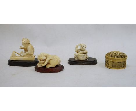 Japanese carved ivory okimono of a seated worker with hammer, signed to base, 4.5cm high, a Japanese carved ivory netsuke of 
