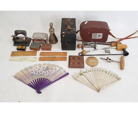 Cast iron paperweight in the form of a raised fist, on rectangular tablet, brass handbell, spring balance scales, desk blotte
