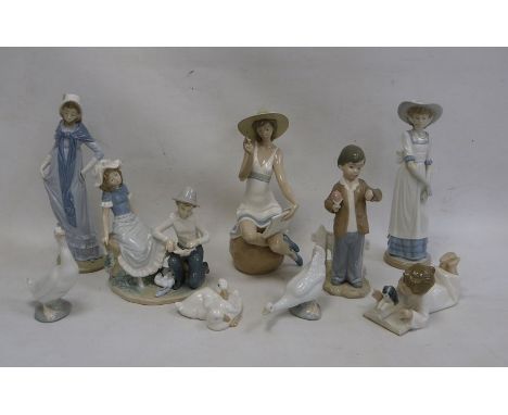 Quantity of Nao figures to include boy bandaging girl's foot, Edwardian-style lady, girl seated on rock with sunhat, boy look