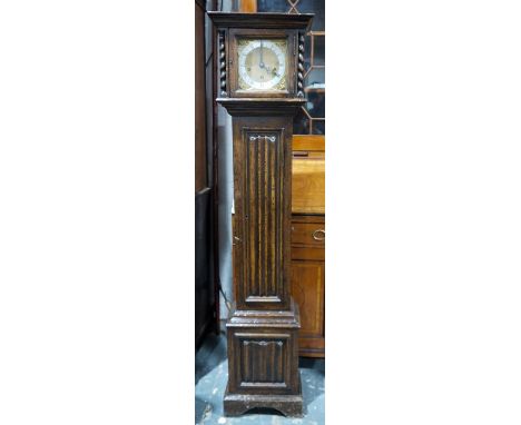 Early 20th century oak-cased longcase clock with brass dial, Roman numerals to the steel chapter ring, linenfold door and pan