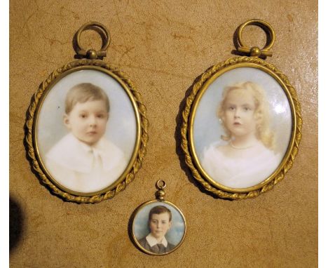 Pair of portrait miniatures on ivory, oval of boy in white collar and girl in pearl necklace, 7cm x 5.5cm and the gilt metal 