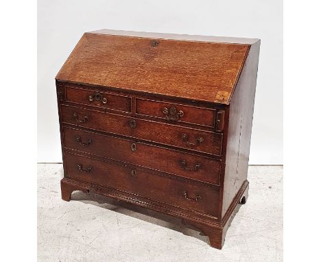 19th century oak bureau, the fall front with fitted interior, two short above three long graduated drawers, on bracket feet, 