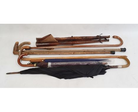 Shooting stick, quantity walking sticks and vintage umbrellas 