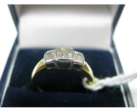 A Modern 18ct Gold Three Stone Diamond Ring, collet rubover set with three rectangular cut stones, graduated.