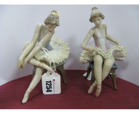 A Lladro Porcelain Model of a Seated Ballerina, printed and impressed marks, 13cm high, boxed and another similar Lladro figu