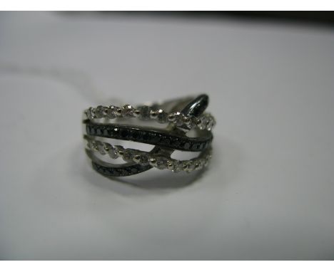 A Modern Black and White Diamond Set Dress Ring, of four row design, approximate total 'white' diamond weight 0.73cts, stampe