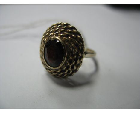 A 9ct Gold Single Stone Dress Ring, oval rubover set within ropetwist textured mount.