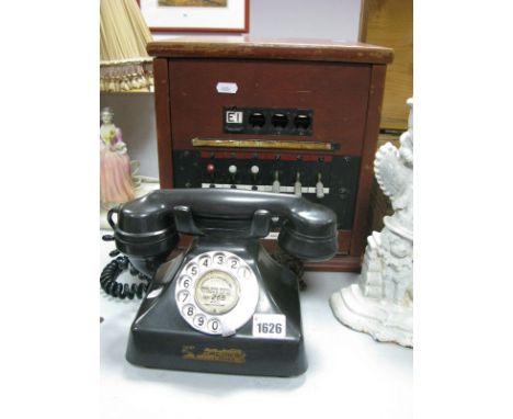 A c.1950's Telephone Exchange Box, with ring and extension switches; together with a black bakelite G.E.C. telephone with ori