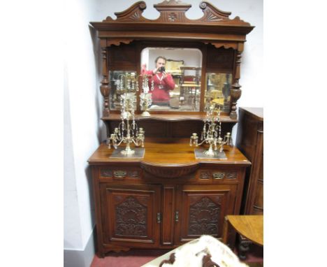 An Early XX Century Walnut Mirror Back Sideboard, with a swan neck pediment, mirror back turned supports, single shelf, base 