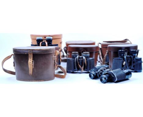 A collection of assorted vintage binoculars.&nbsp; Models are: Zenith 7 x 50 field 7.1, Carl Zeiss Deltrintem 8 x 30, Ross Lo