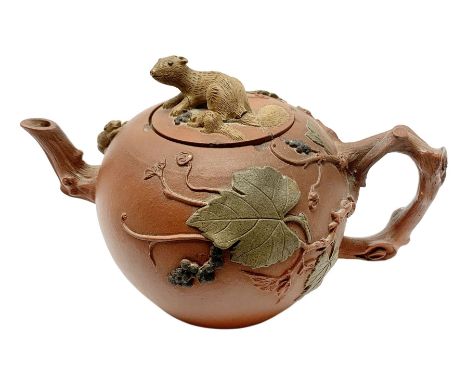 19th century Staffordshire redware teapot, with crabstock handle and spout, the body decorated with applied fruiting vines an