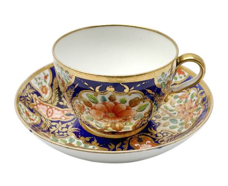 Early 19th century Spode teacup and saucer, decorated in pattern no 1216, the Imari pallet interspersed with circular panels 