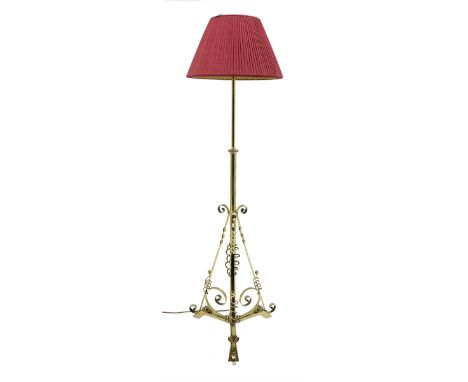 Early 20th century brass standard lamp, telescopic stem with three splayed supports, scroll work to the base, H180cm (max hei