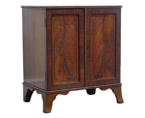 Regency ebony strung mahogany medal or coin collectors cabinet, with reeded top, two panel doors enclosing eleven drawers, sh